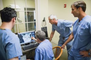 The doctors examining a patient's x-ray